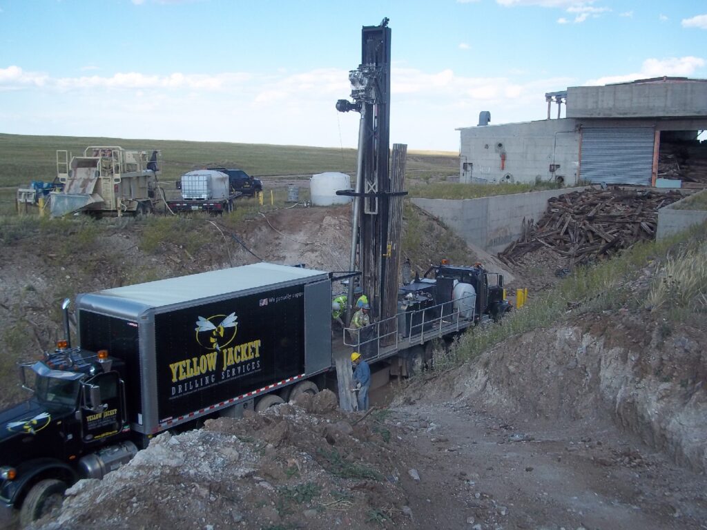 Photograph 3. Sonic drill rig in flame pit at LSB 1, retrieving core from the MW74 boring in summer 2017.